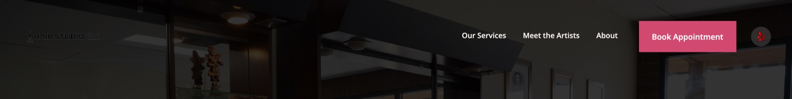hairstudiog10.com header over the dark hero photo: white wordmark, nav links, and the rose Book Appointment button